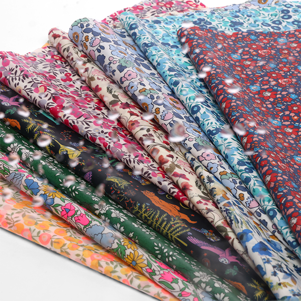 Présentation de nos tissus Liberty enduits, parfaits pour des accessoires, nappes disponibles chez Stragier