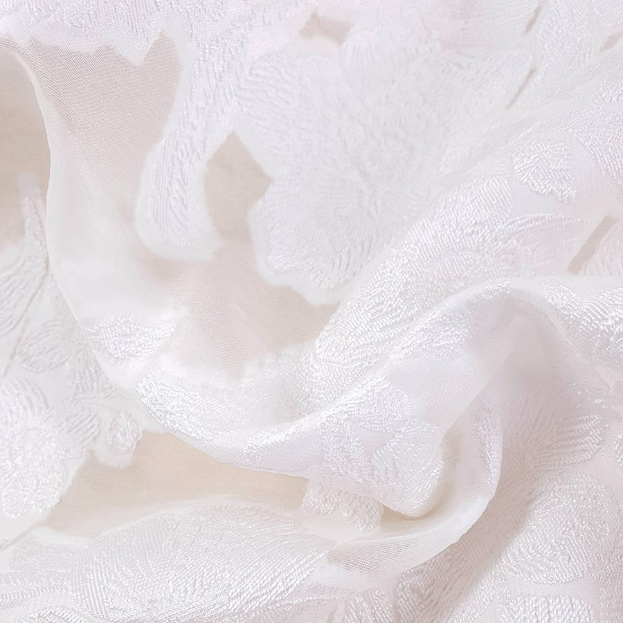 Un Organza Jacquard - fils coupés en coloris Ivoire claire Stragier